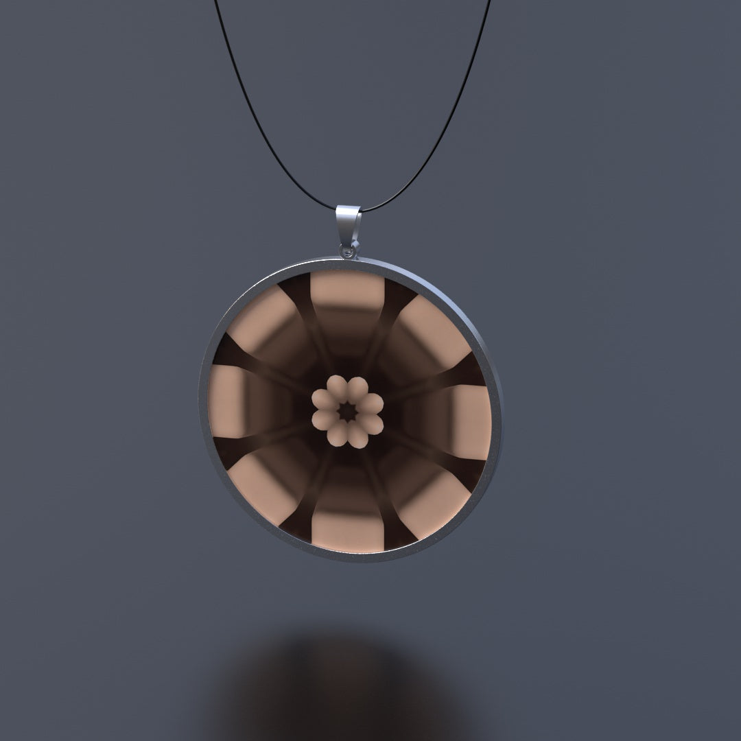 Anhänger in Edelstahl mit einem Durchmesser von 43mm aussen und 40mm innen und einer 3D/Motion-Einlage mit 40mm Durchmesser. Ein Kautschuk-Band mit Bajonett-Verschluss in Edelstahl wird mitgeliefert.